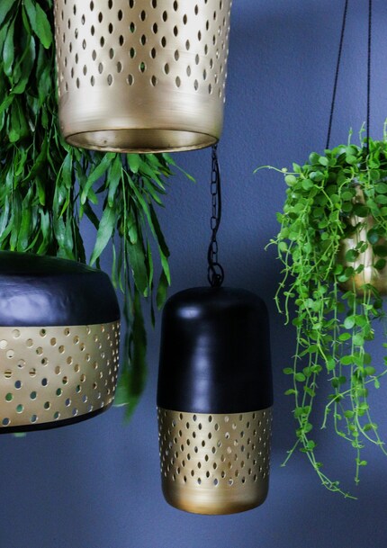Matt gold and gloss black at Atelier Lumina. The imperfections lend an ethno charm and the perforation fancy effects. 