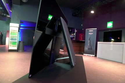Right: the back of the A1 OLED with bent panel.
