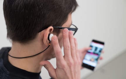 The right headphone is touch-controlled