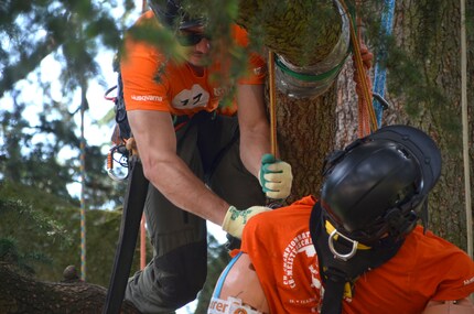 A participant tries to free the dummy from its predicament.