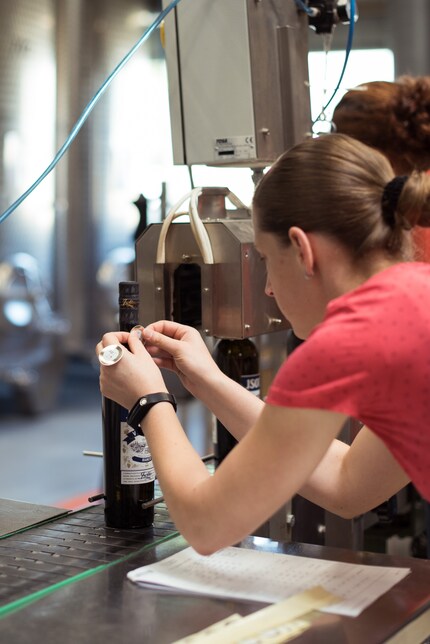 Adding the finishing touches by hand: The machines couldn’t handle the award label.