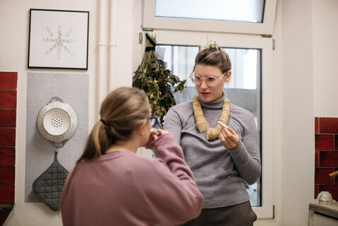 Carla tells me her necklace is made of slices of horseradish. The smell off of it helps with her cold