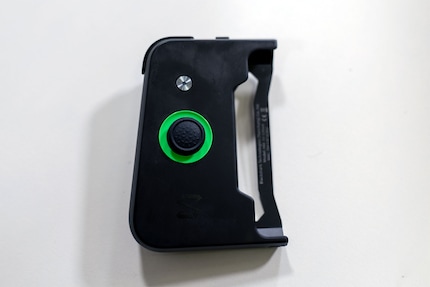 The gamepad is connected to the phone via Bluetooth