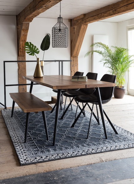 Benches are a space-saving solution for long dining tables. Image: Dutchbone