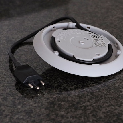 The cable can be rolled up on the underside of the base.