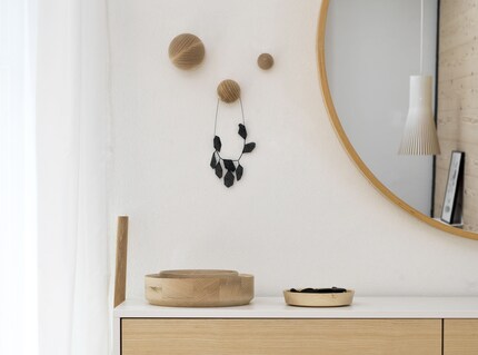 Pegs embellishing a wall. Photo: Kommod