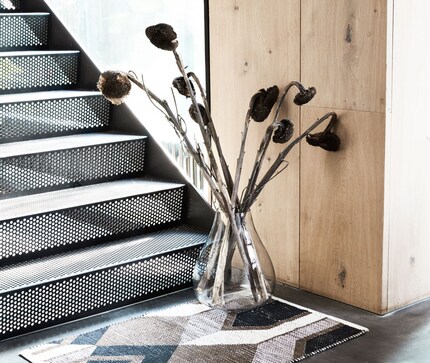 Highlight your vases with rugs. Image: House Doctor