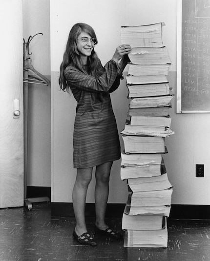 Margaret Hamilton with the printed Apollo software.