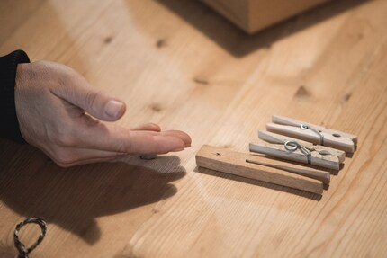 Three generations of clothes pegs.