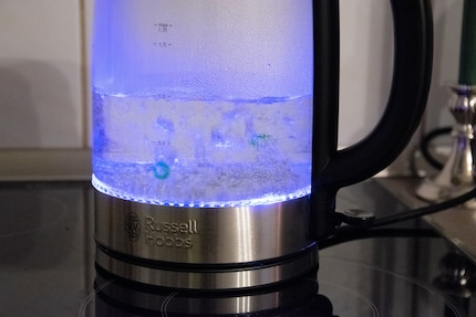 The glass body lights up in a pleasant blue