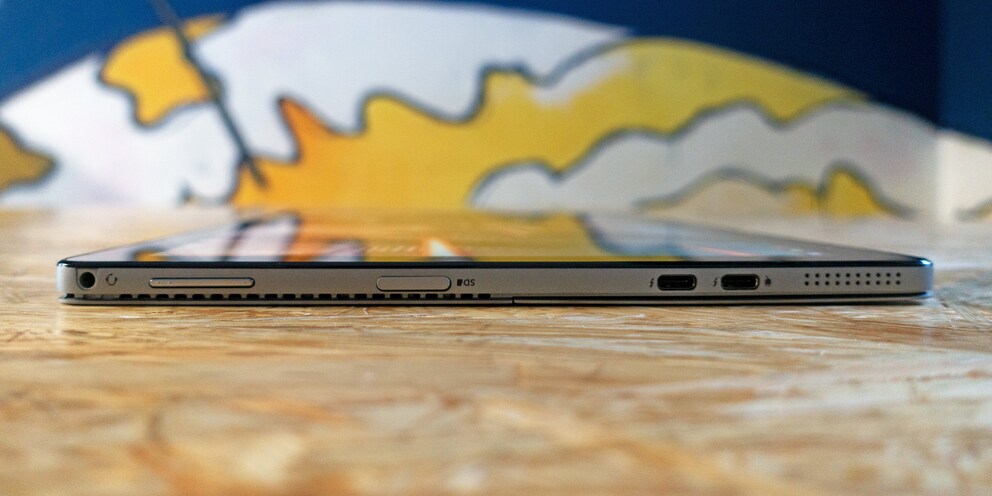 3.5 mm audio jack, volume rocker, microSD slot, 2 × Thunderbolt 3