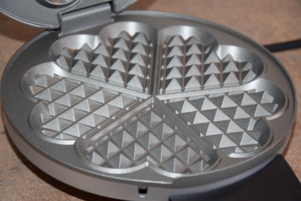 The baking plates inside are non-stick coated, so you don't need to grease them.