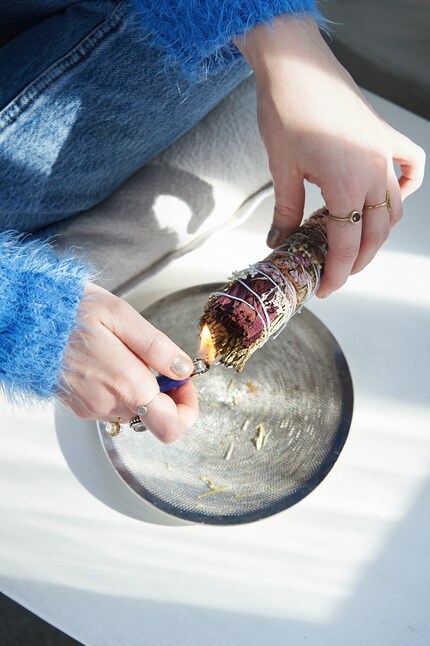 When Carina welcomes her friends for a medation, she first cleans the room by burning a bunch of dry herbs and letting the smoke disperse throughout the premises.