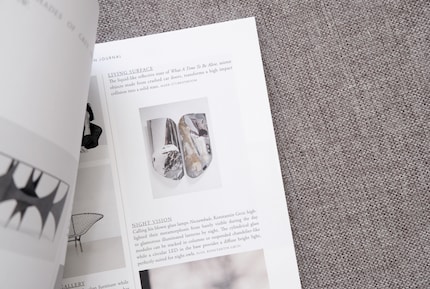 A stack of print magazines helps with the search for ideas.