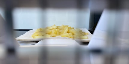 The waxy potatoes are cut and cooked, the starchy ones are next.