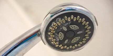 If your shower head is caked in limescale and all clogged up, it’s time for a soak in vinegar.