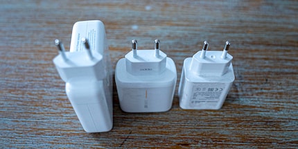The Macbook charger delivers up to 87 watts. That’s too much for smartphone chargers.