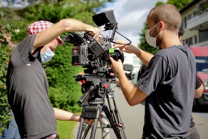 Le cameraman et ses assistants