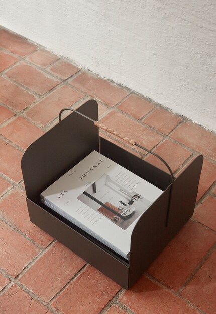 Metal newspaper holders store paper neatly. Photo: Oyoy