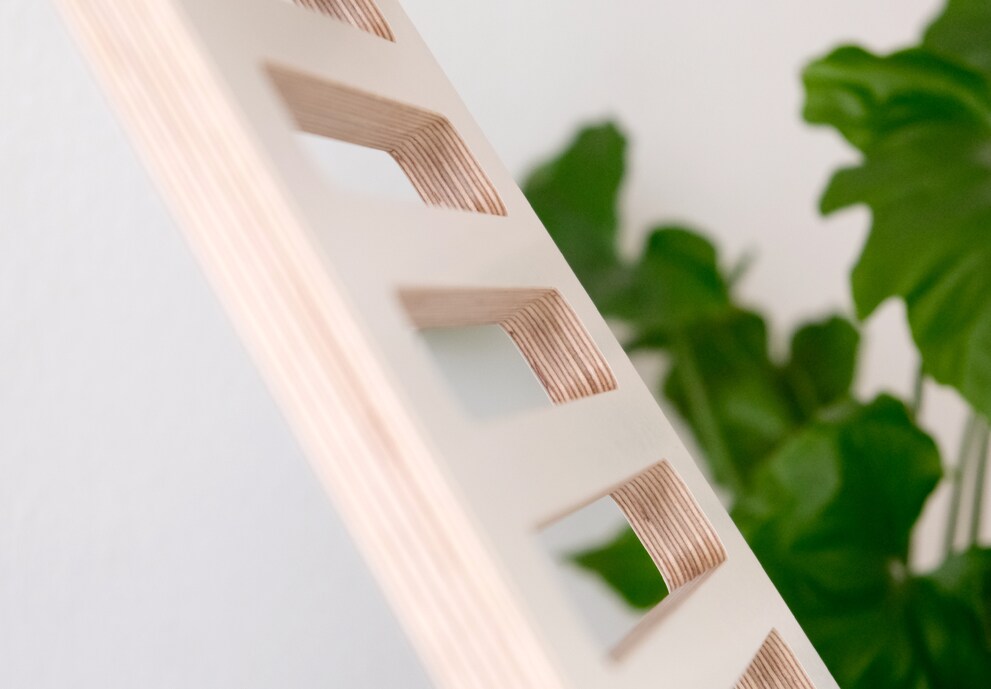 The Upstaa's wooden details create a contrast with the decorative frame.