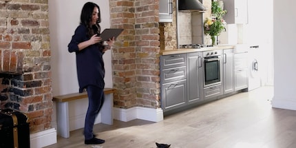 Many people build a dedicated fireplace. This one is being blocked by a suitcase.