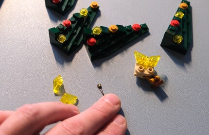 Big fingers, tiny studs.