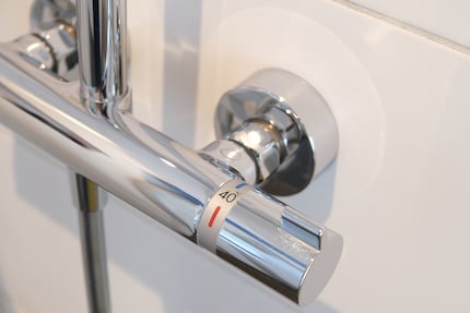 If your shower installation has a thermostat dial, you can likely install a very economical shower head.