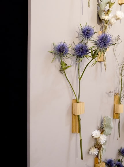 A wall hanger is a beautiful alternative to a vase.