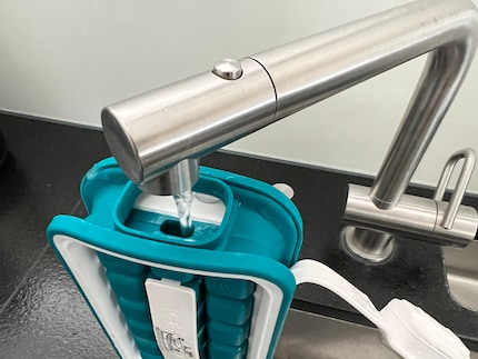 Filling is precise work: the hole is so small that I can only fill it with a small stream of water.