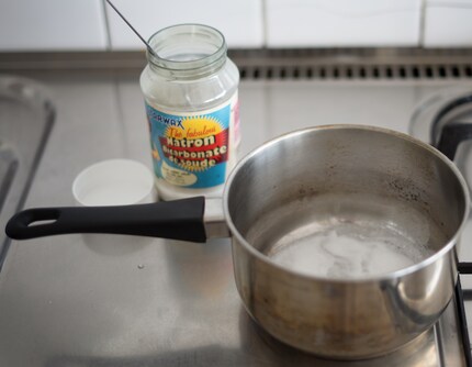 The baking soda treatment has removed all the burnt tomato sauce.