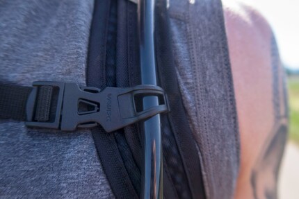 The hose is fixed to the carrier with a small clip.
