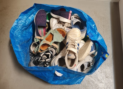 Bag ‘em up: almost all of our shoes end up in an Ikea bag.