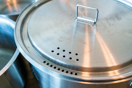 Good ideas are not necessarily good work. The holes in the lid are unfortunately too small or too few to be able to drain water really well.