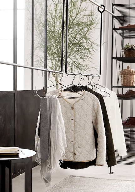 This hanging, filigree rack makes these it-pieces look like they’re floating.