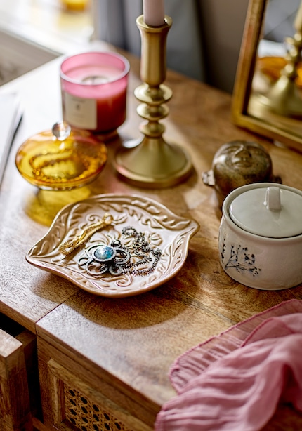 The Lizz design has an organic shape and is embossed with a pattern.