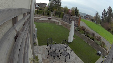 Without defined zones, the camera turns on and sends a message as soon as it detects motion anywhere in the field of view, so for example also on the driveway on the right side of the image.