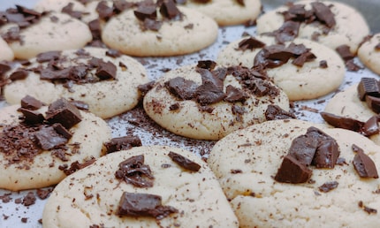 lay them on top of the still-warm cookies after baking so that they melt gently into the dough.