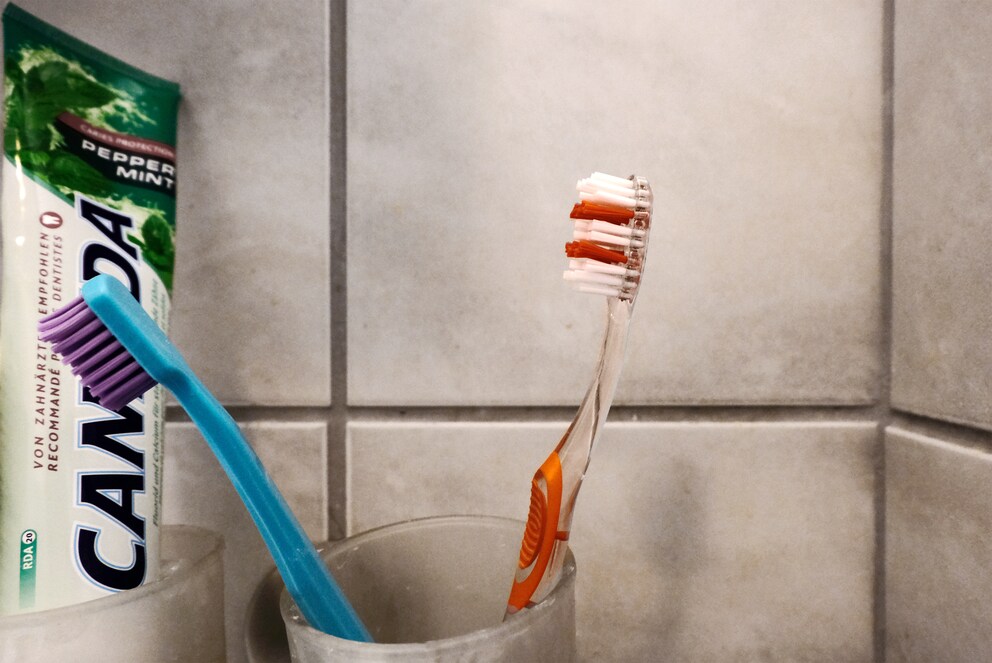 One toothbrush without and one with dosage indication.