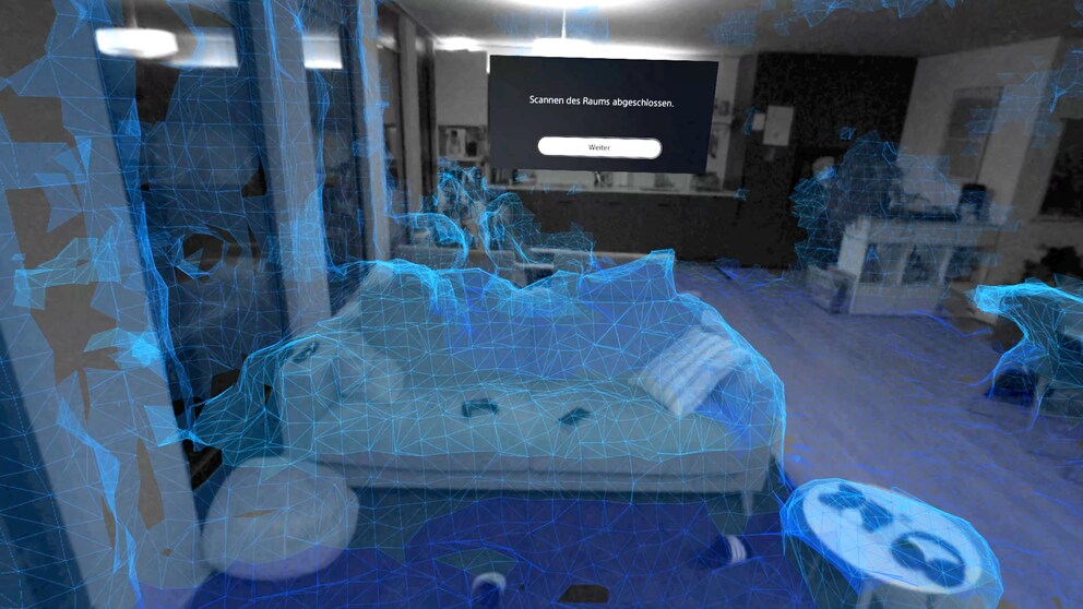 Ecco come il visore VR vede il divano e il resto del soggiorno. Più poligoni blu sono visibili durante la scansione, meglio è.