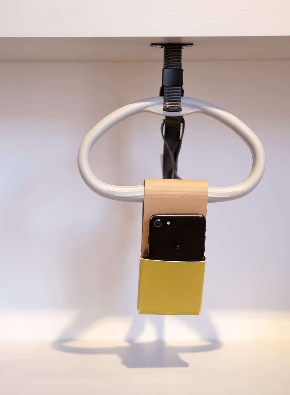 The mobile phone holder is a foldable everyday aid for bedridden people.
