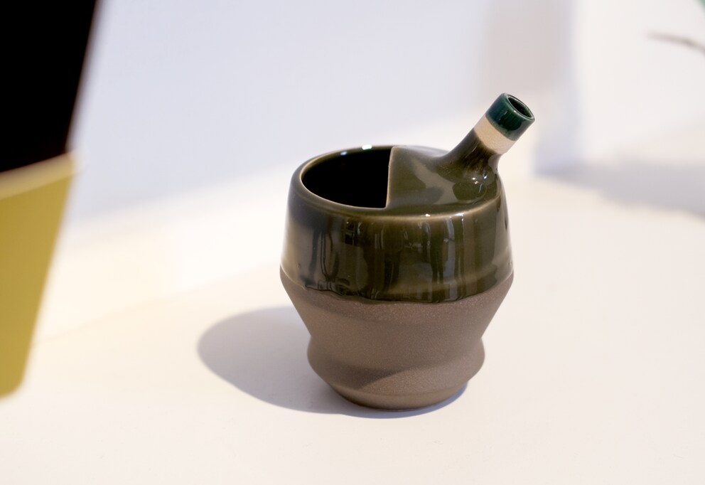 Colour makes the ceramic spill-proof cup look prettier.