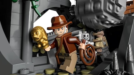 Indiana Jones secures the golden relic.