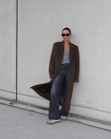 The brown maxi coat looks casually elegant here.