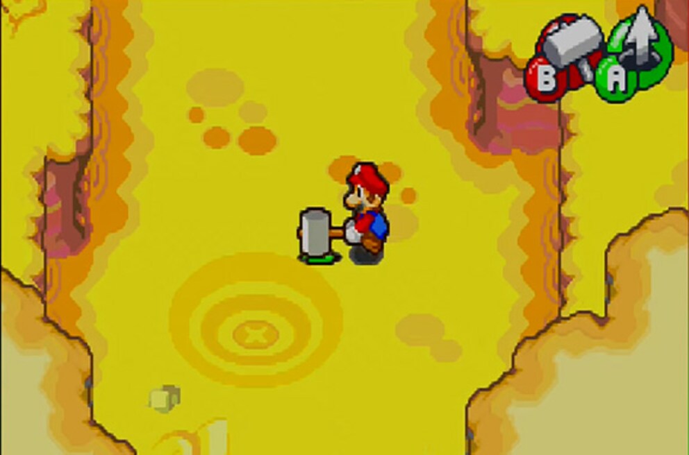 Con il martello, Mario spinge il fratello nel terreno per fargli cercare un tesoro sepolto. Divertente.
