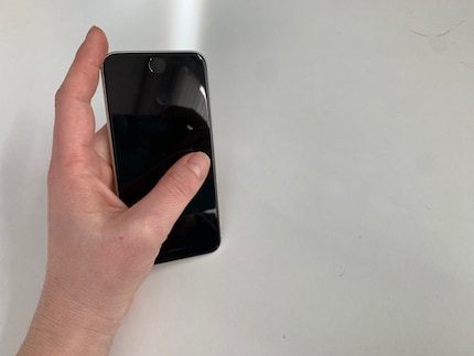Back in my hand. Constantly reaching for my smartphone is like a reflex, and it throws me off.