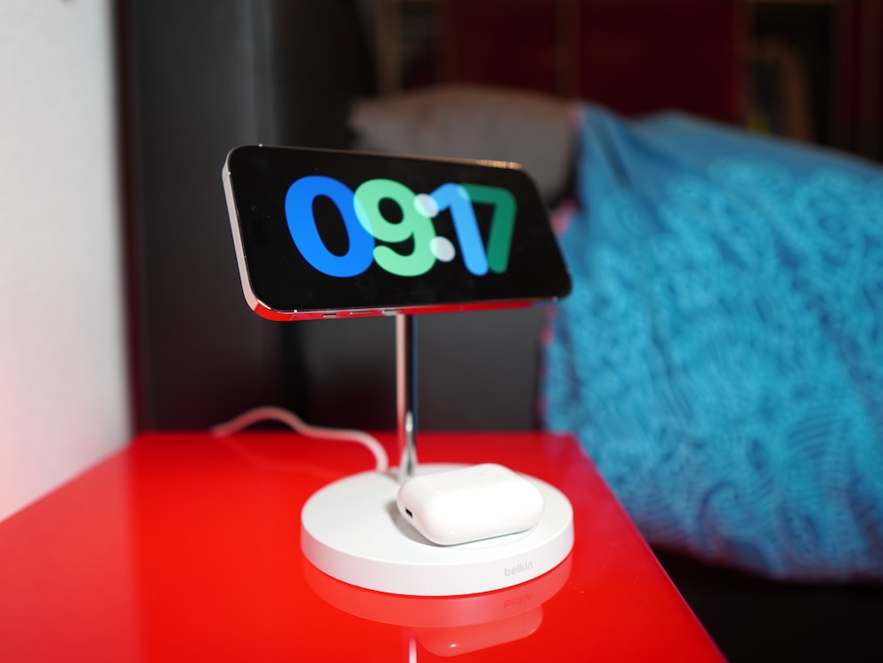 This charger from Belkin holds the iPhone via magnet. On the stand, you can charge a second device.
