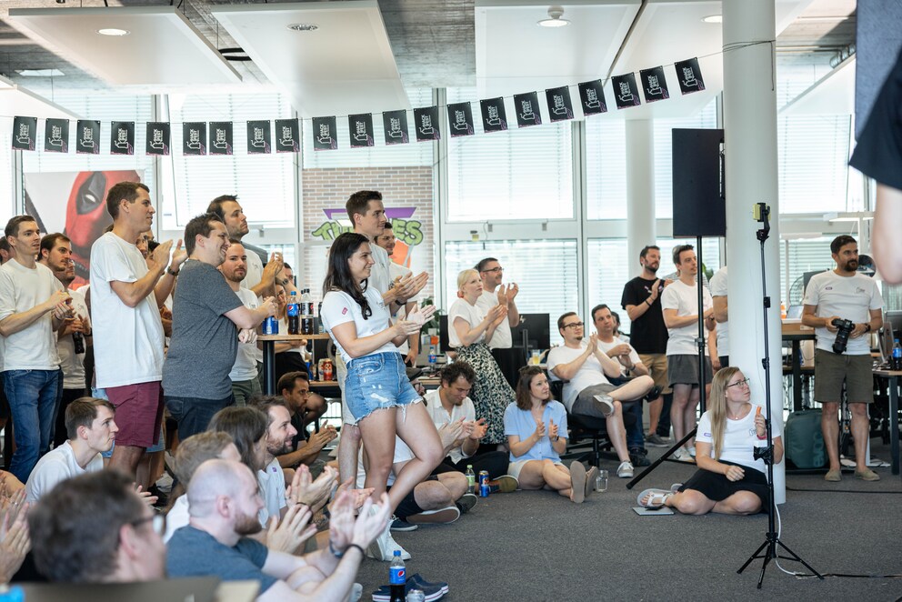 The Hackathon teams came together with other employees for the final presentation.