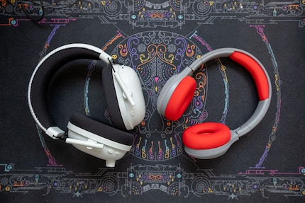 The Tigerbuddies (right) compared to an adult headset.