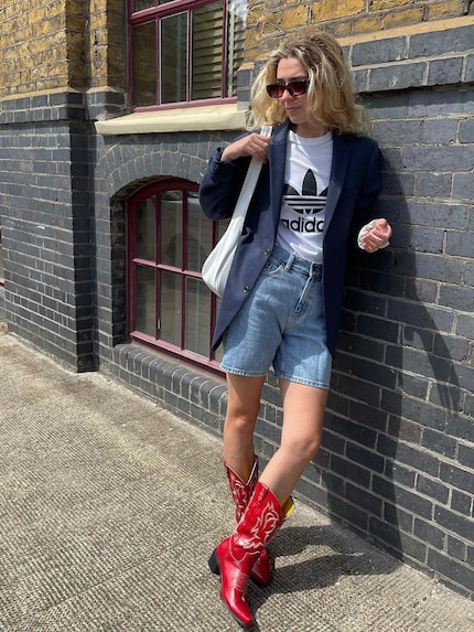 Red boots with white embroidery are eccentric eye-catchers.