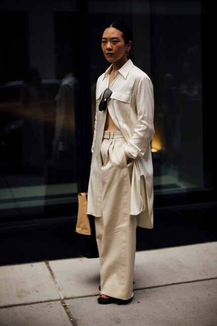 Shirt dresses look very stylish when worn half-buttoned over trousers.